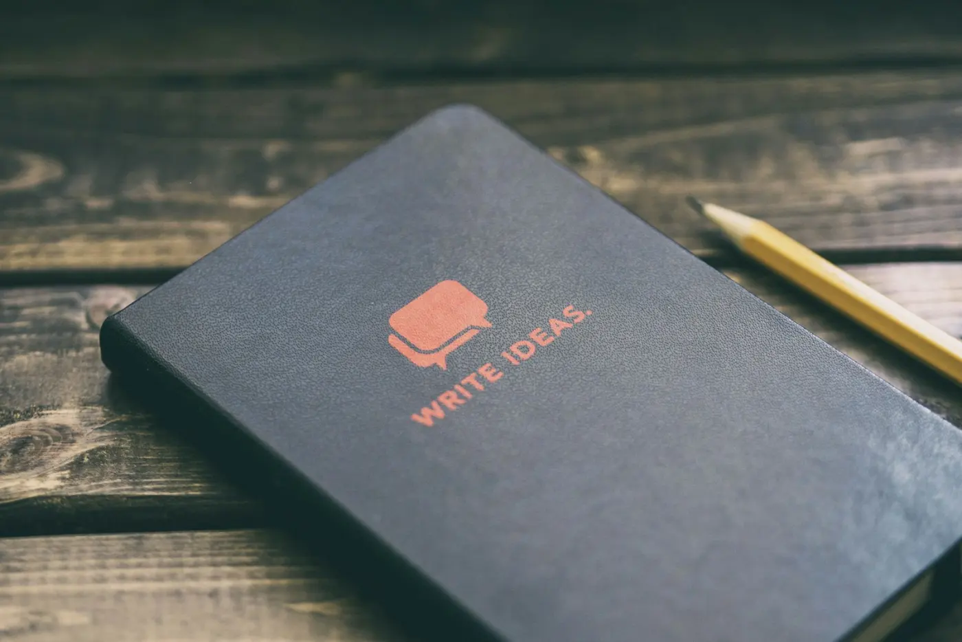 Open book manuscript with red editorial pen annotations and margin feedback notes
